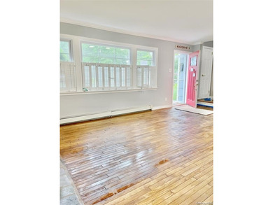 Sun-Drenched Expanded Brick Ranch in Kings Point Village! - photo 3