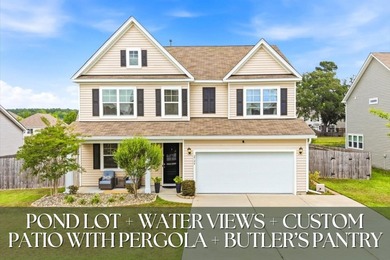 Situated on a premium pond lot, this stunning home is located - photo 1