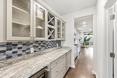 Situated on a premium pond lot, this stunning home is located - photo 9