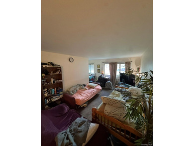 Discover your new beginning in the heart of Islip! This spacious - photo 1
