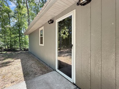 SECLUDED! Tucked away on 1.75 wooded acres, this cute 3-bedroom - photo 2