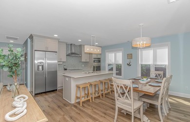 LUXURY at the BEACH!!! This LAKE FRONT 4 bedroom 3.5 bath raised - photo 7