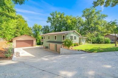This stunning 4-bedroom, 4-bath tri-level home sits on one of - photo 3