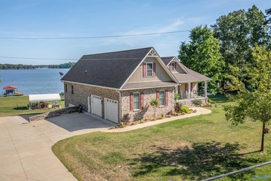 Waterfront living at its best! This striking brick 3-level home - photo 1