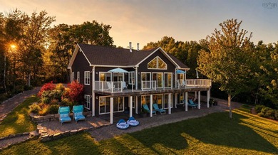 Welcome to an extraordinary turnkey waterfront retreat, where - photo 1