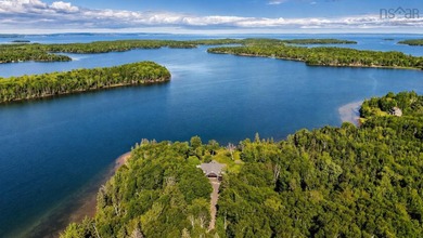 Welcome to an extraordinary turnkey waterfront retreat, where - photo 2