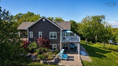Welcome to an extraordinary turnkey waterfront retreat, where - photo 8
