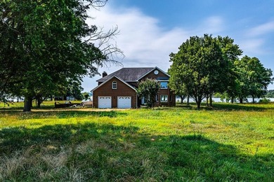 Stunning brick home built on 2 waterfront lots, in a premier - photo 2