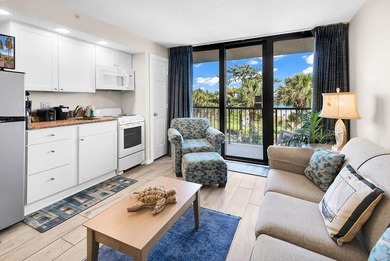 Welcome to Unit 207 at Beach Colony Resort, a charming 1-bedroom - photo 13