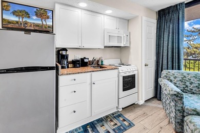 Welcome to Unit 207 at Beach Colony Resort, a charming 1-bedroom - photo 15