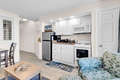 Welcome to Unit 207 at Beach Colony Resort, a charming 1-bedroom - photo 18