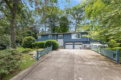 THIS OVERSIZED RAISED RANCH SITS IN A QUIET NEIGHBORHOOD IN - photo 1