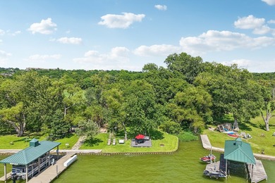 This lakefront home is a unicorn! Located within the gated - photo 2
