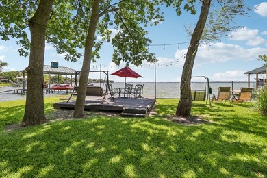 This lakefront home is a unicorn! Located within the gated - photo 3