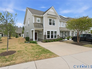 WELCOME HOME to this beautifully appointed end-unit townhome in - photo 1