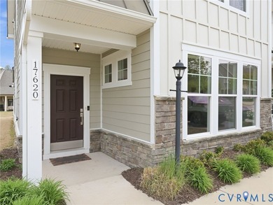 WELCOME HOME to this beautifully appointed end-unit townhome in - photo 2