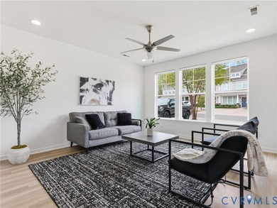 WELCOME HOME to this beautifully appointed end-unit townhome in - photo 3