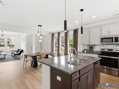 WELCOME HOME to this beautifully appointed end-unit townhome in - photo 8