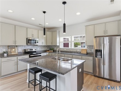 WELCOME HOME to this beautifully appointed end-unit townhome in - photo 10