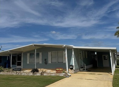 Welcome to this charming two-bedroom mobile home located in the - photo 2