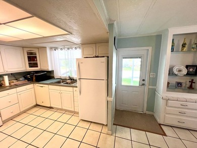 Welcome to this charming two-bedroom mobile home located in the - photo 7