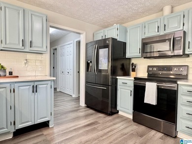 Spacious lake home on a level lot with year-round water! This - photo 10