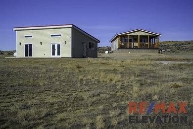 Set on 35.5 acres, this property features two modern homes, a