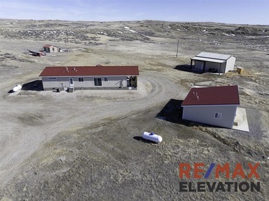 Set on 35.5 acres, this property features two modern homes, a