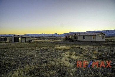 Set on 35.5 acres, this property features two modern homes, a