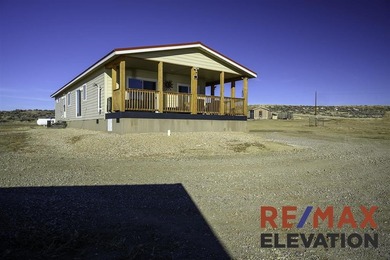 Set on 35.5 acres, this property features two modern homes, a