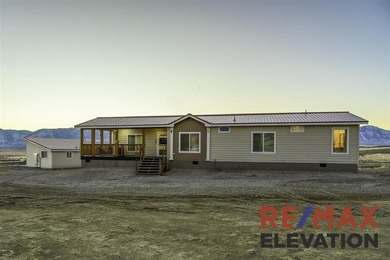 Set on 35.5 acres, this property features two modern homes, a