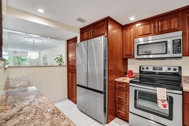 Updated 2 bedroom, 2 bathroom condo. Features an open floor plan - photo 6