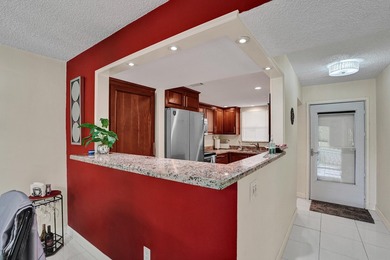 Updated 2 bedroom, 2 bathroom condo. Features an open floor plan - photo 7