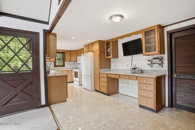 A massive floor-to-ceiling brick fireplace, rumored to contain 3 - photo 11