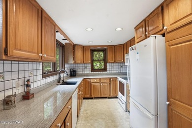A massive floor-to-ceiling brick fireplace, rumored to contain 3 - photo 14