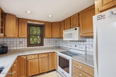 A massive floor-to-ceiling brick fireplace, rumored to contain 3 - photo 15