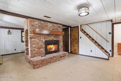 A massive floor-to-ceiling brick fireplace, rumored to contain 3 - photo 36