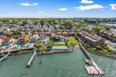 Set behind private gates on an oversized waterfront parcel, this - photo 2