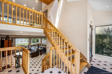 Set behind private gates on an oversized waterfront parcel, this - photo 6