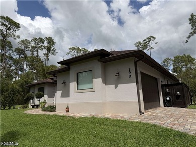 Located at 190 2nd St SE in Naples, this 2.5 acre retreat offers - photo 3
