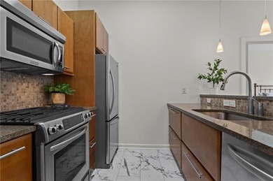 Welcome home to an elevated, turnkey condo experience in the