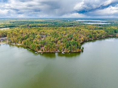 Located on the 28 Lake Chain, this exceptional property boasts - photo 1