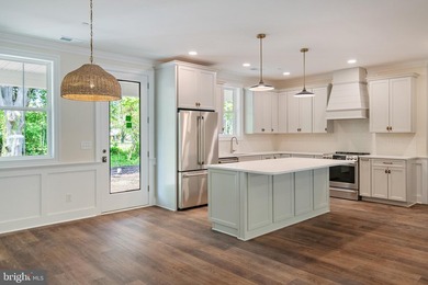 STUNNING NEW CONSTRUCTION located within the highly sought-after - photo 2