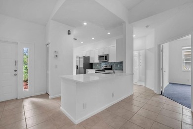 Welcome home to this beautifully updated villa in the highly - photo 12