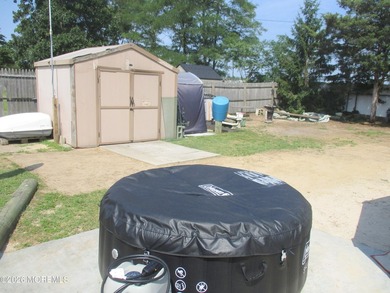 GEM IN THE ROUGH!! Original 3 bedroom converted to 2 bedroom and - photo 22