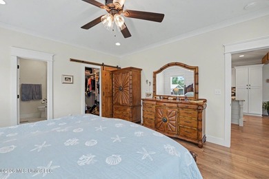 Nestled amongst majestic Live Oaks on one of Waveland's most - photo 13