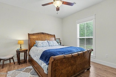 Nestled amongst majestic Live Oaks on one of Waveland's most - photo 17