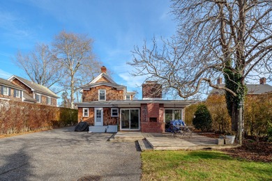 Set on a quiet Southampton Village street, this classic village - photo 18