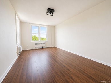 Welcome home to this bright and inviting top-floor one-bedroom - photo 9