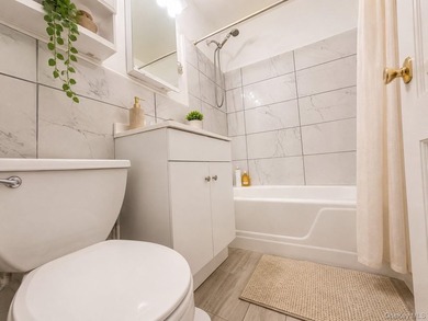 Welcome home to this bright and inviting top-floor one-bedroom - photo 10